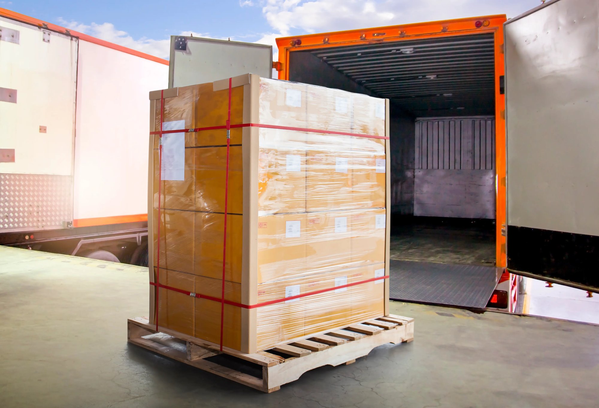 packaging-boxes-wrapped-plastic-pallets-loading-into-shipping-cargo-container-delivery-trucks packaging-boxes-wrapped-plastic-pallets-loading-into-shipping-cargo-container-delivery-trucks